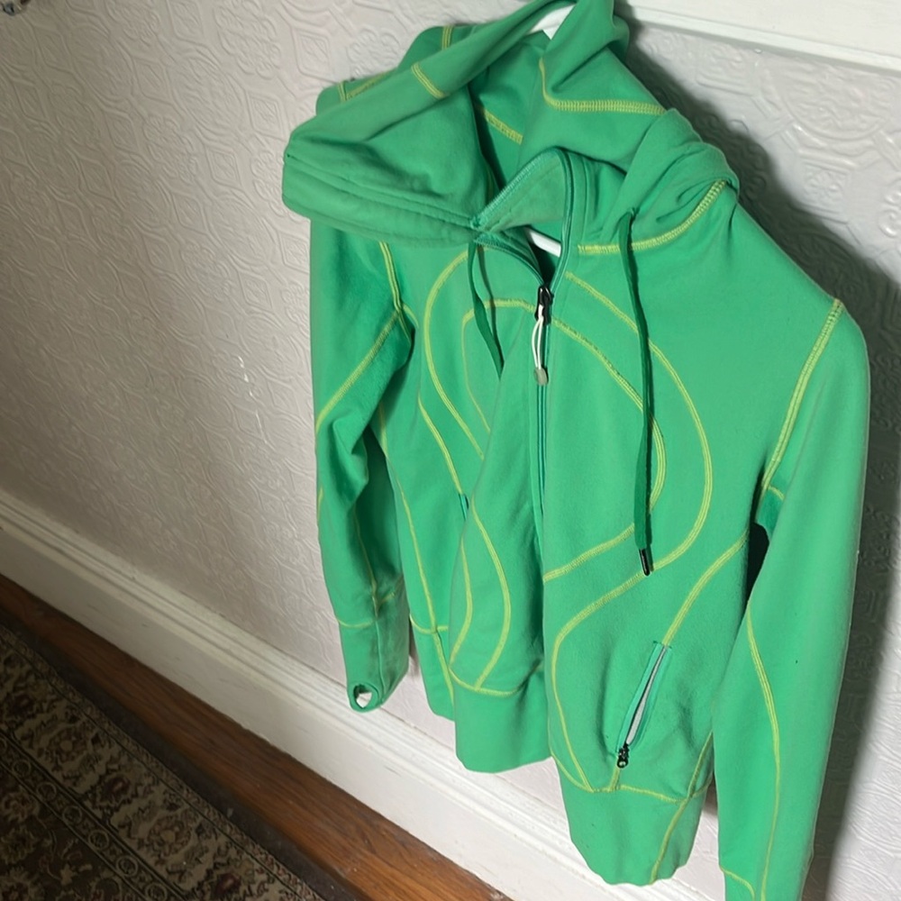 Lululemon bottom separating zipper.  Hooded lite weight jacket Thumb holes.
